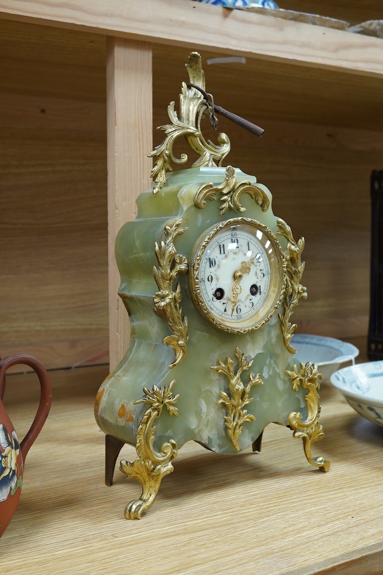 A Louis XV style onyx mantel timepiece, with key, 40cm high